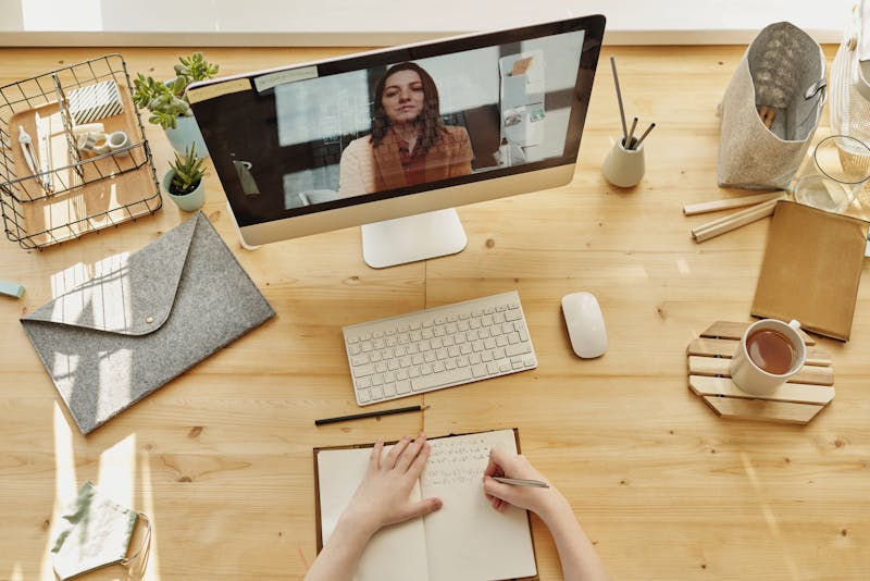 Parent using laptop to chat with daycare